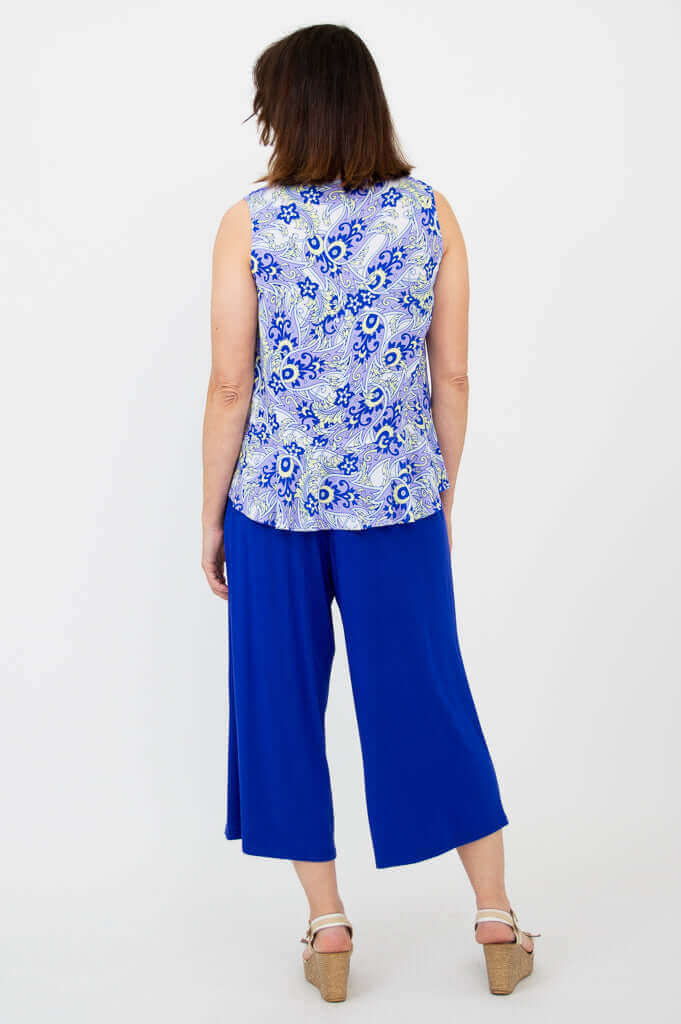 Back view showing peplum hem of Ginny Tank in blue paisley print