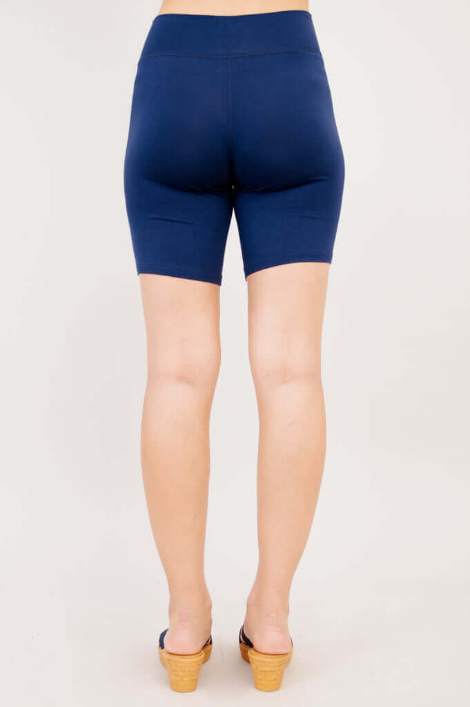 Back view of woman wearing navy Hallie Bamboo Shorts showing seamless design