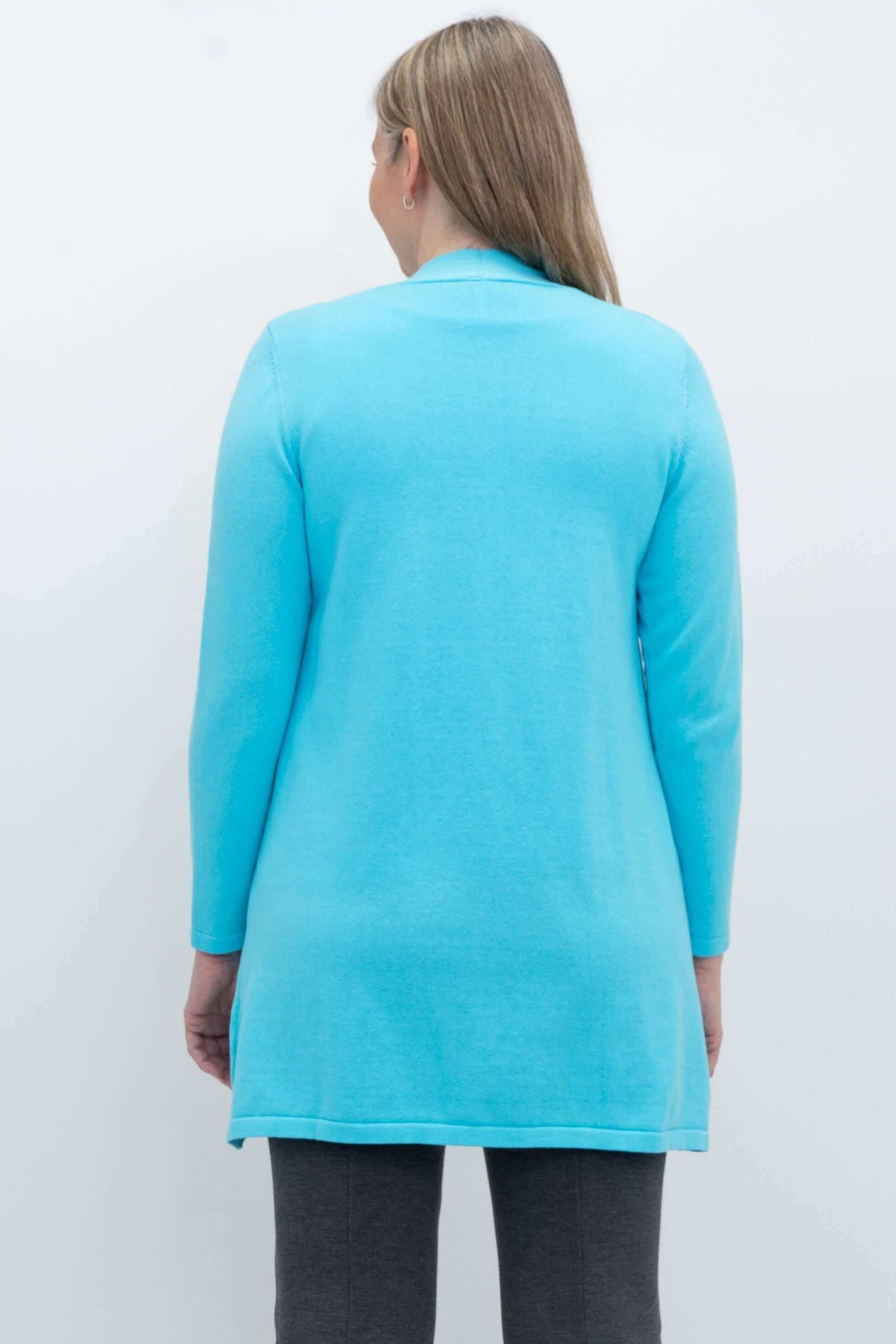 Back view of aqua blue open cardigan sweater worn by a woman