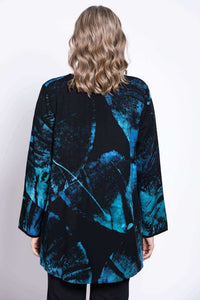 Back view of woman displaying the blue and black abstract batik print of the Kary Blouse