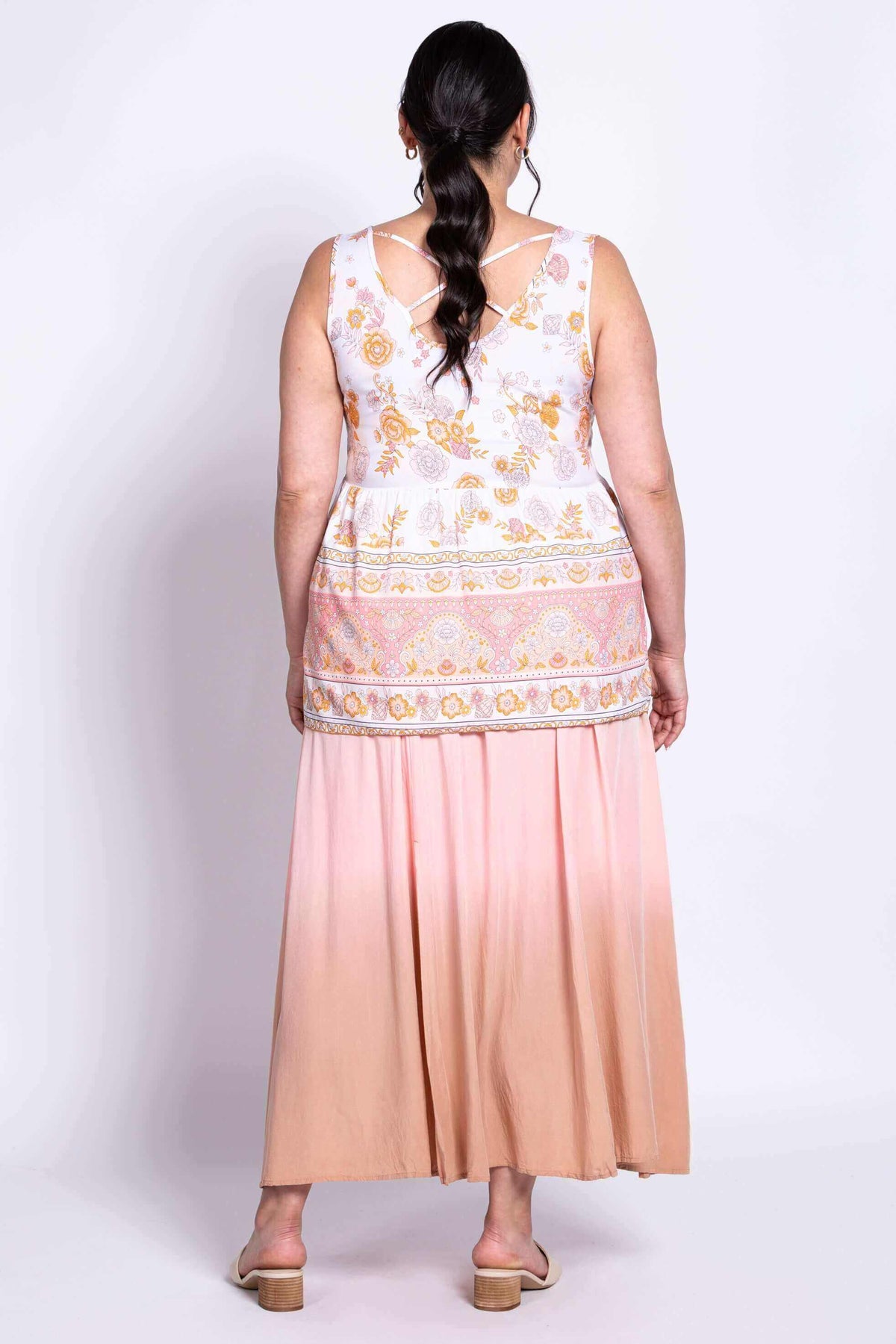 Back view of model showing criss cross detail on the Kaya Floral Tank Top