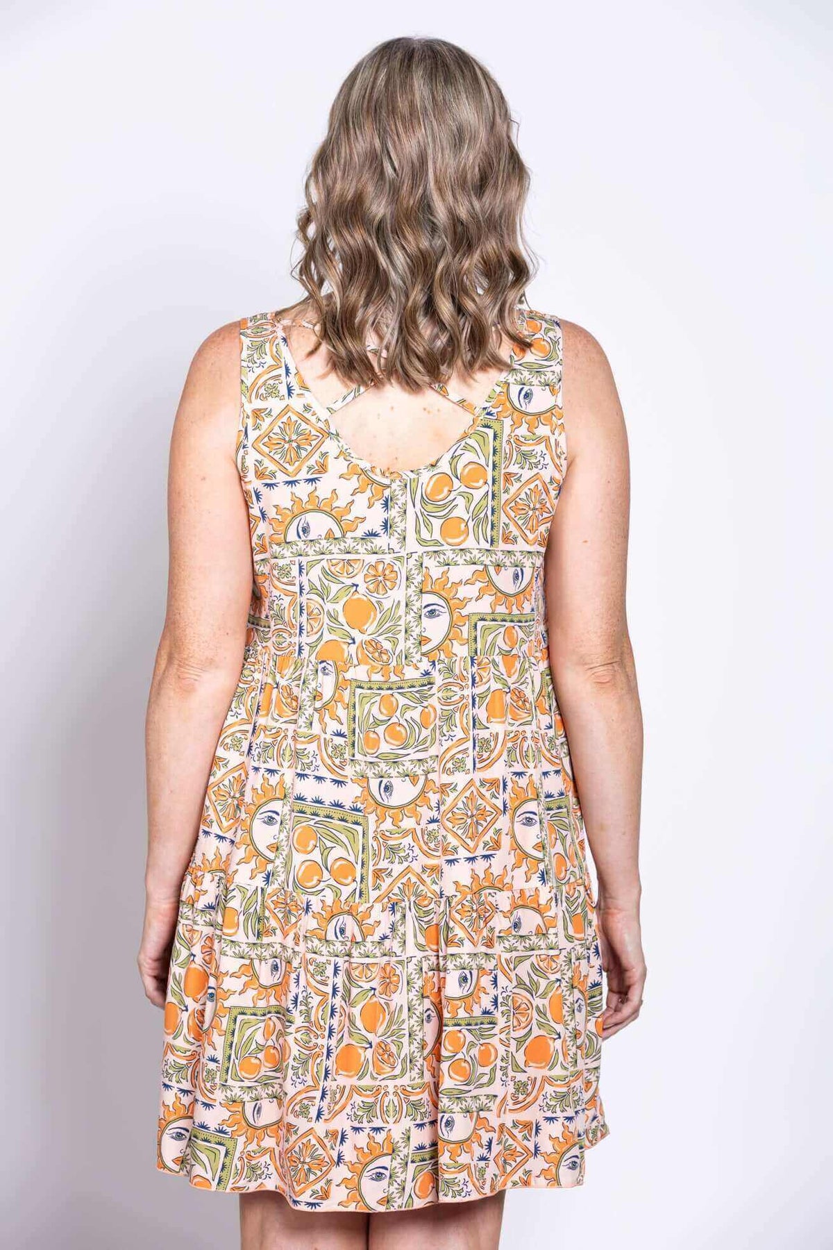 Back view of Kaya dress showing criss cross detail and patterned fabric