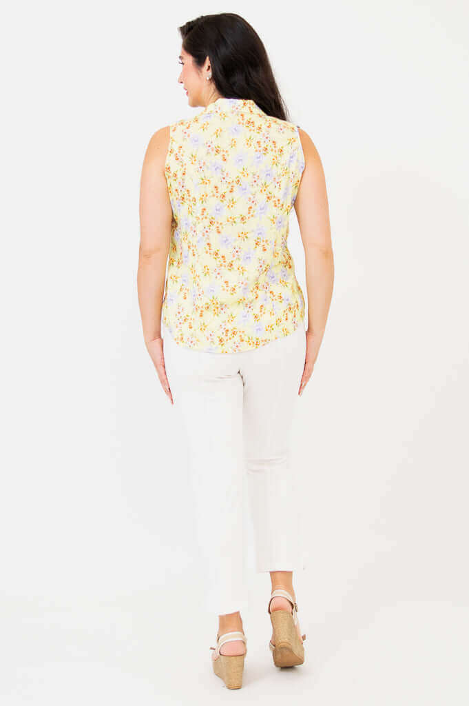 Back view of model wearing Lexa yellow floral sleeveless shirt