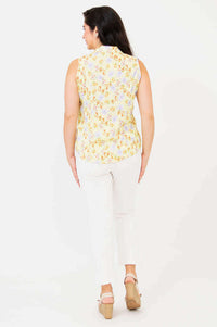 Back view of model wearing Lexa yellow floral sleeveless shirt