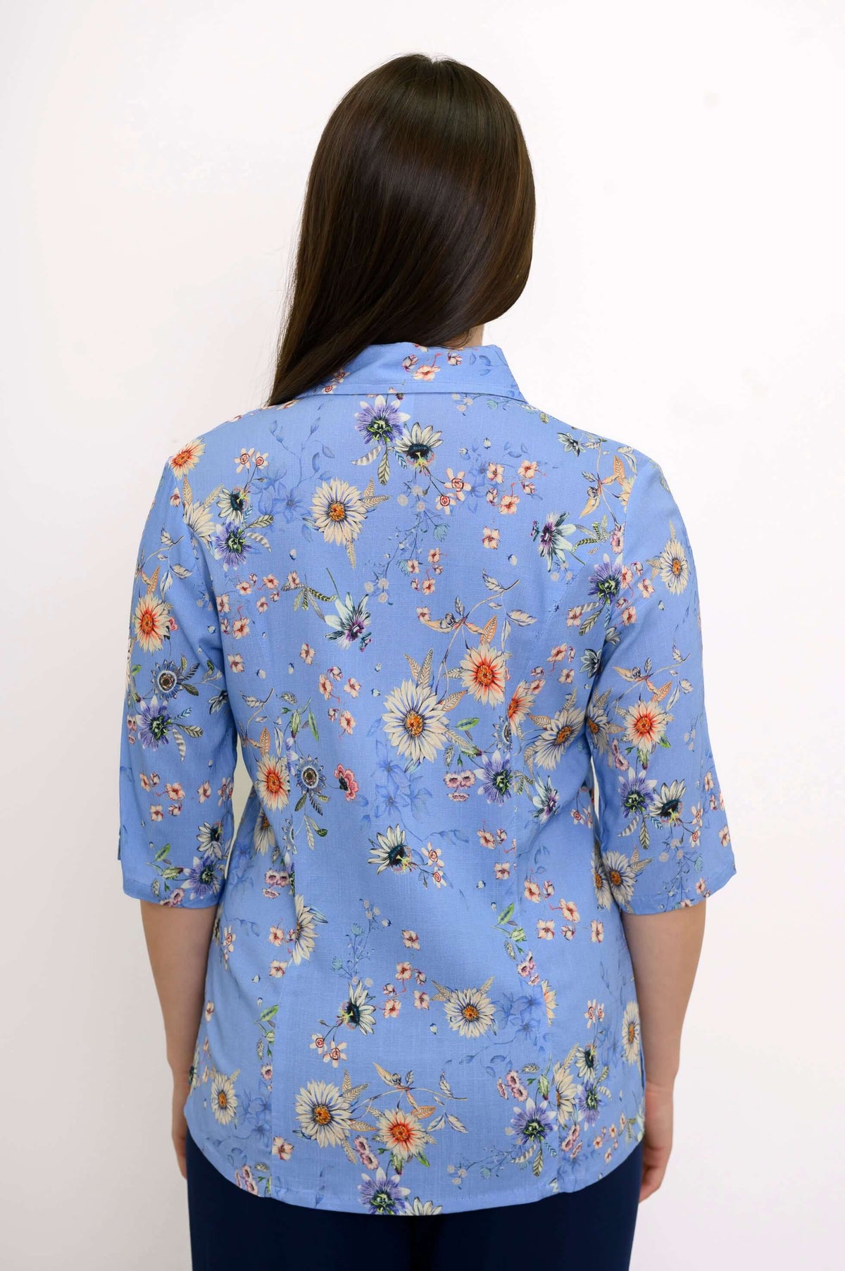 Back view of the blue floral bamboo-linen blouse showing floral pattern and seaming