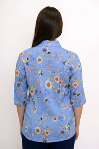 Back view of the blue floral bamboo-linen blouse showing floral pattern and seaming