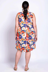 Back view of a woman wearing a floral Maggie Shift Dress