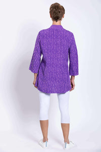 Rear view of violet Mar blouse showing loose fit and abstract pattern