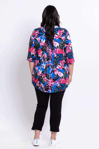 Back view of woman showing the flow of the Margate blouse with vivid leaf print