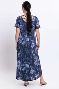 Back view of model in Martha maxi dress showcasing back strap detail and floral pattern