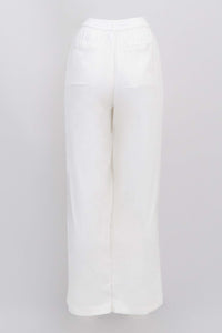 Back view of white trousers against a white background featuring elastic waistband and pockets