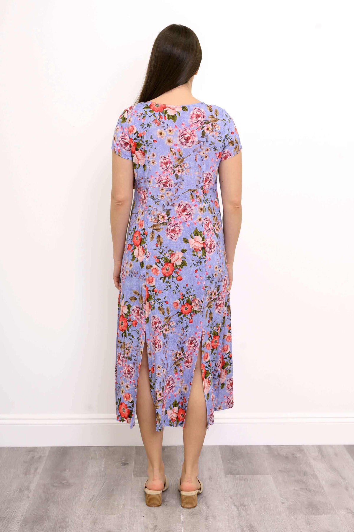 Rear view of Morgan floral midi dress showing back slits and flowing fabric