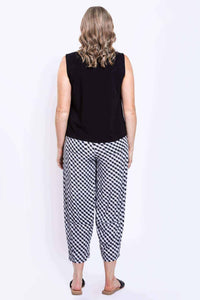 Back view of model wearing black Nina tank and checkered pants