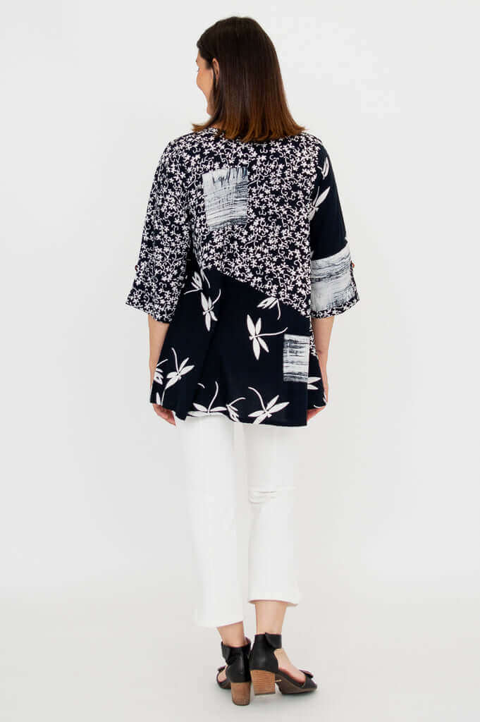 Back view of Palace Blouse showing floral and abstract print details