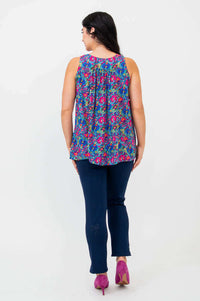 Back view of model wearing the Peachy pleated tank top showing pleats and relaxed fit