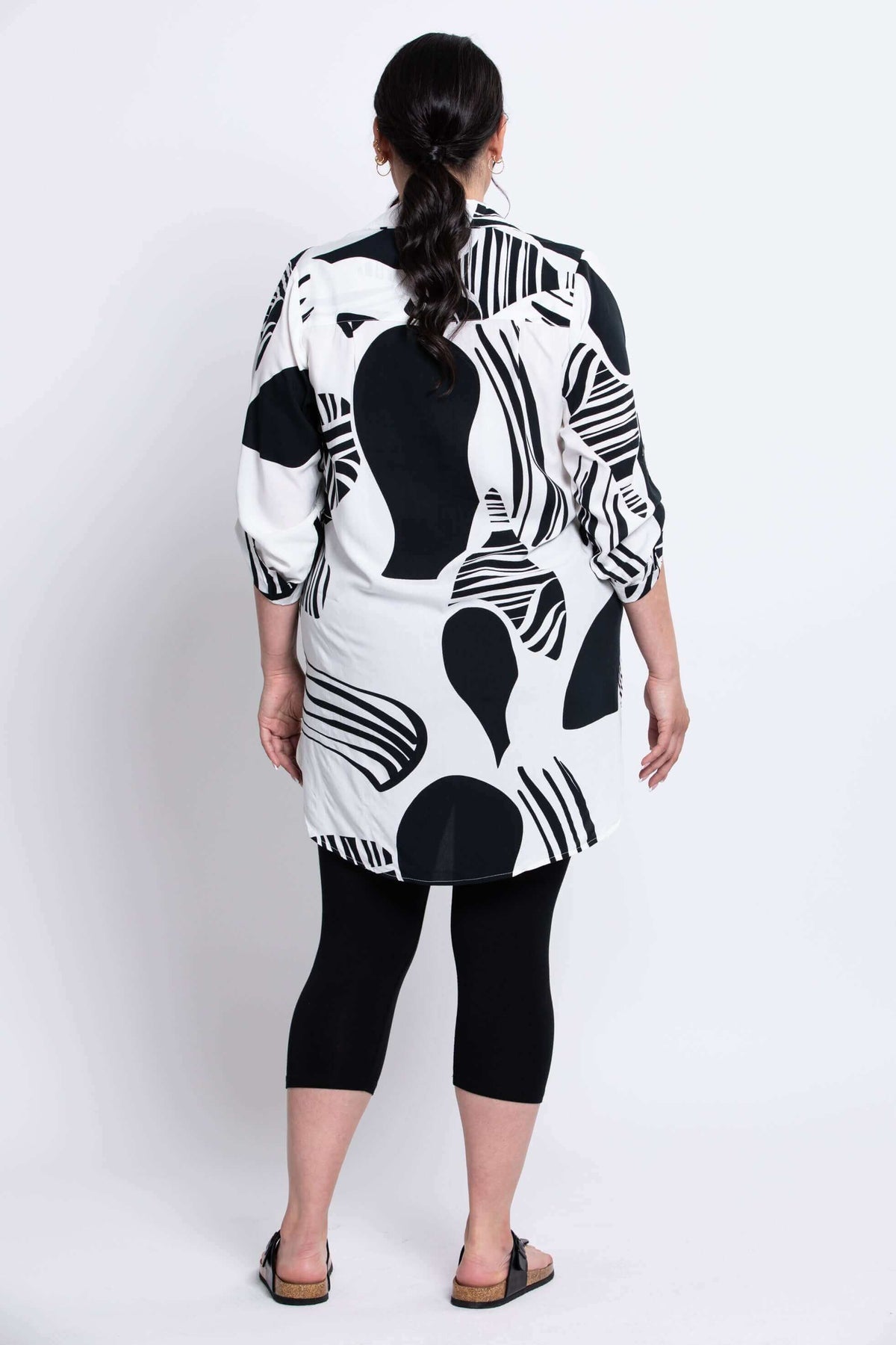 Back view of Queenie Tunic showing abstract pattern and high-low hem