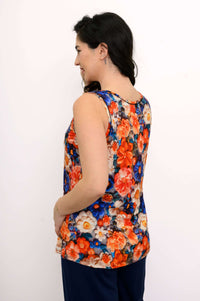 Back view of woman in a reversible floral bamboo tank top with wide straps