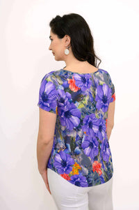 Back view of woman wearing Ritzy Short Sleeve Top with allover floral print