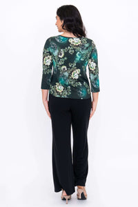 Back view of green floral sweetheart top with 3/4 sleeves, paired with black pants