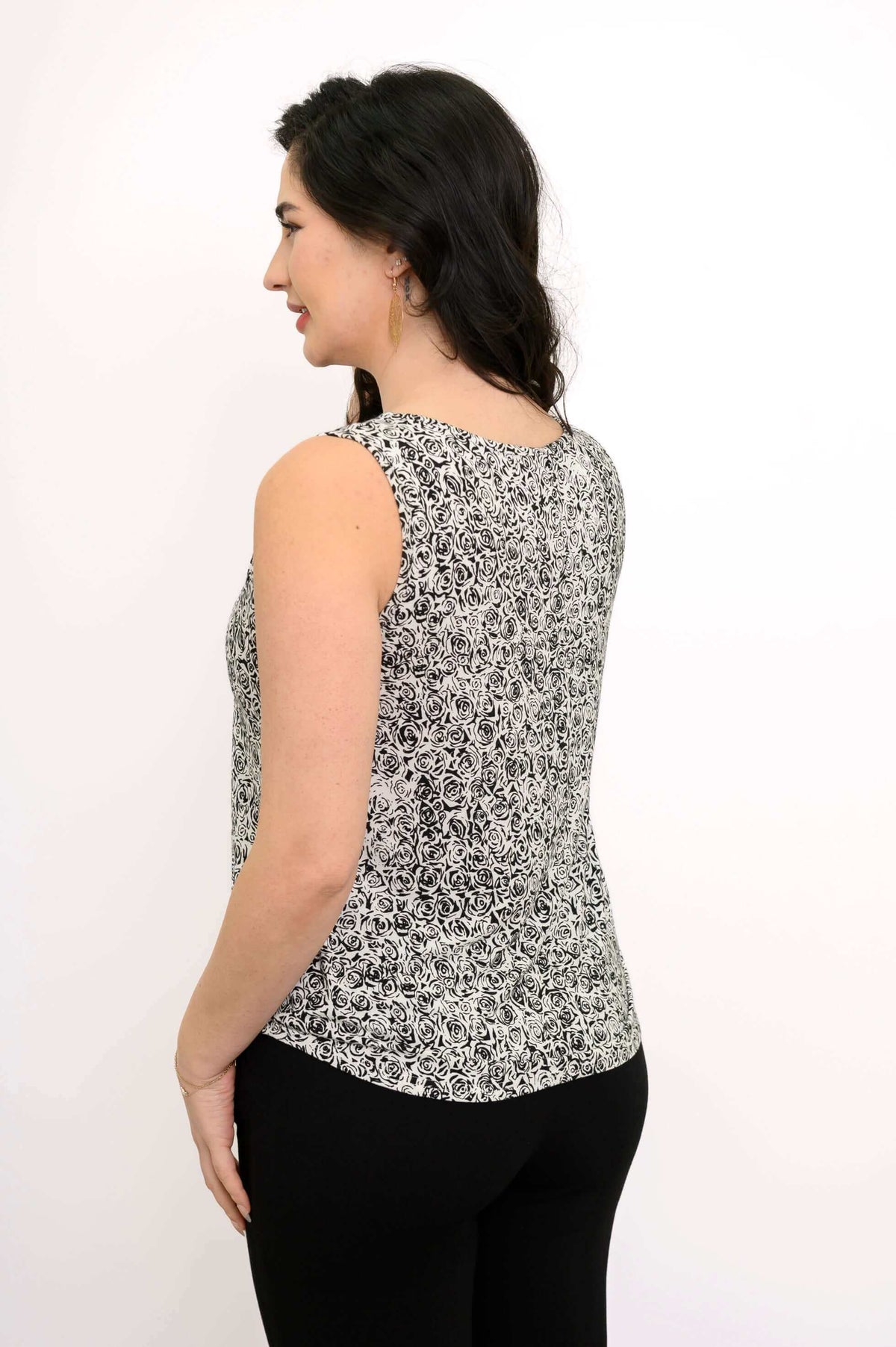 Back view of model wearing Ritzy Tank, highlighting fluid hem and rose print