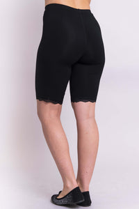 Back view of black bamboo undershorts with lace trim on model