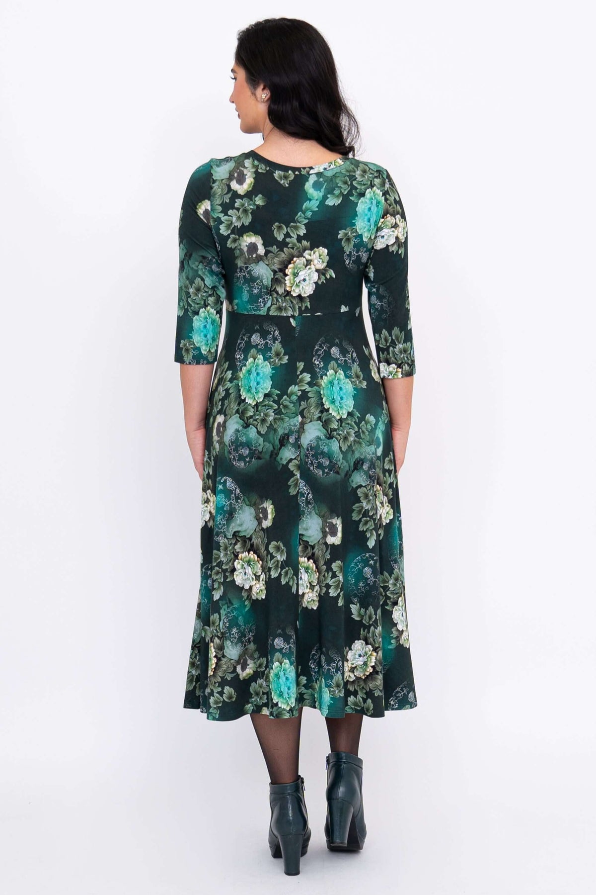 Back view of emerald green floral midi dress showing 3/4 sleeves and full skirt