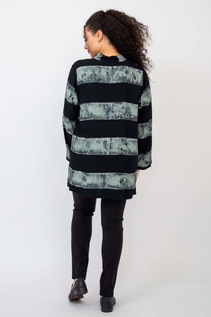 Rear view of model wearing Talina Batik Stripe Blouse showing elongated back