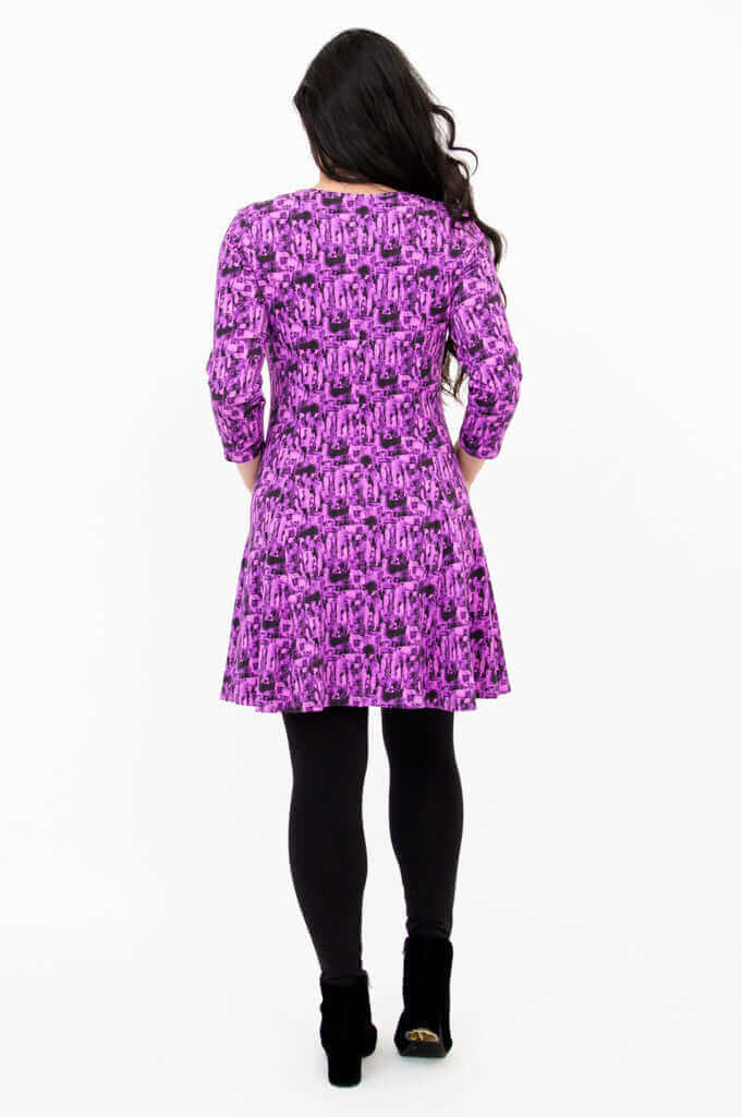 Back view of Wilma Tunic in Violet Brush print showing fit and flare skirt