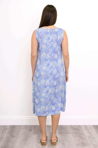 Back view of a woman in a blue floral sleeveless dress with straight hair