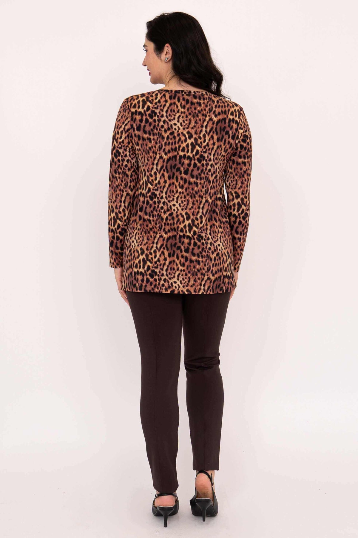 Back view of a woman wearing the leopard print long sleeve top and brown pants