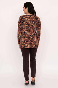 Back view of a woman wearing the leopard print long sleeve top and brown pants