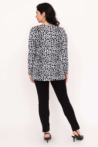 Back view of woman in long sleeve animal print tunic top showing side slits