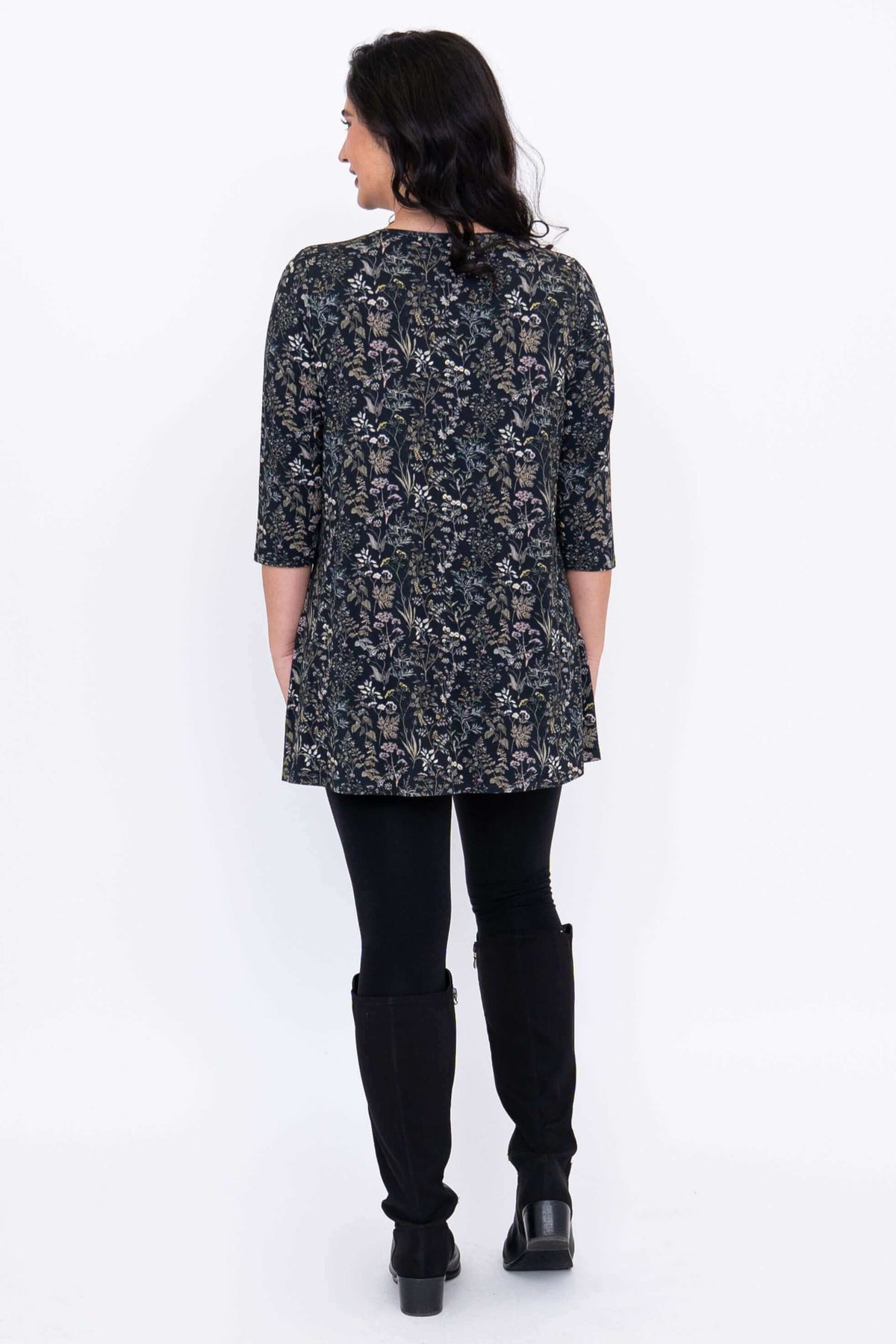 Back view of model wearing the floral bamboo tunic top with 3/4 sleeves