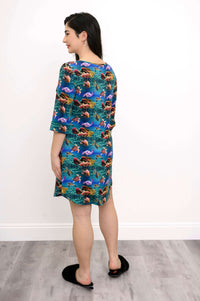 Back view of a woman wearing a bamboo sleepshirt with colorful sea life design