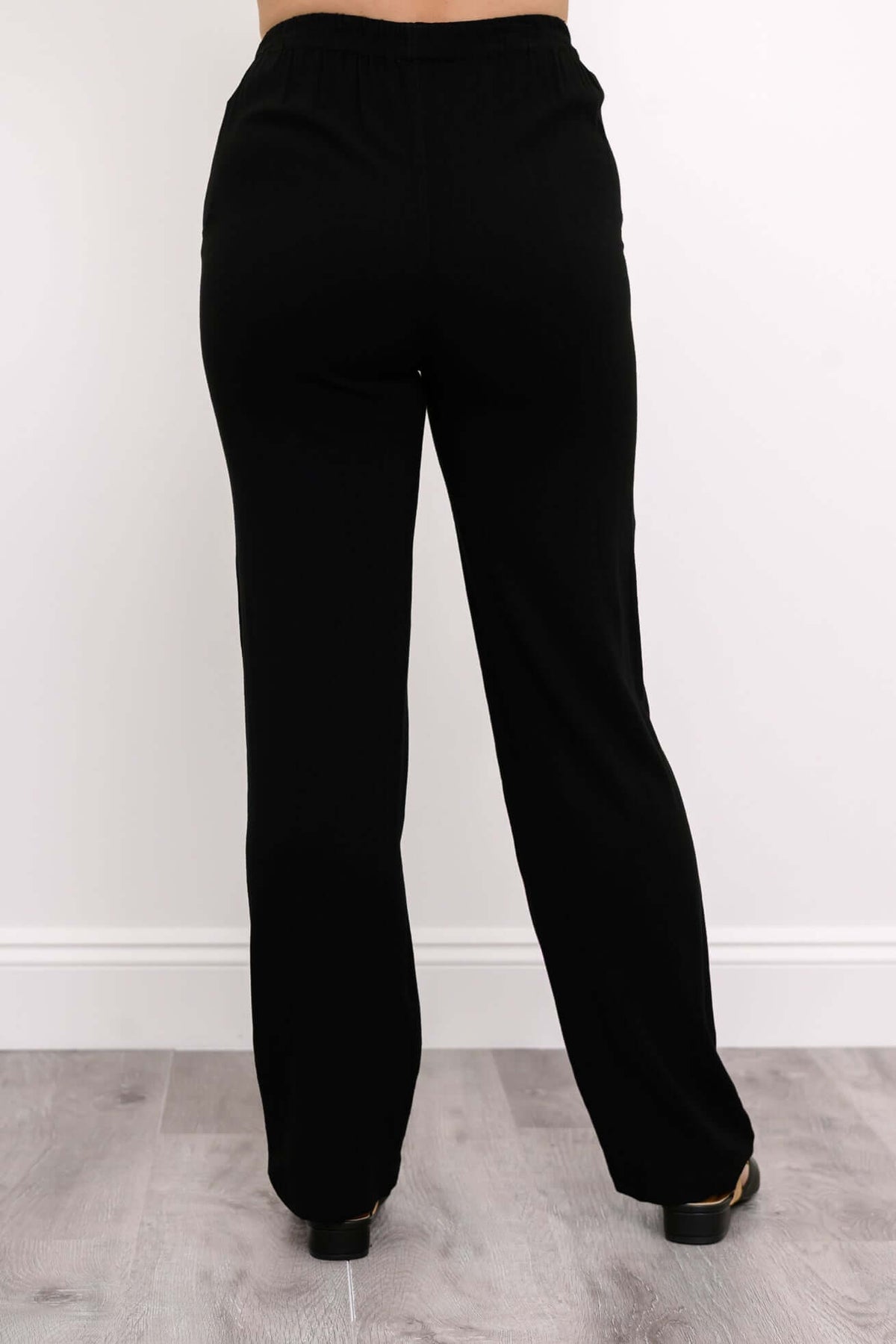 Back view of black bamboo-linen trousers with straight leg style