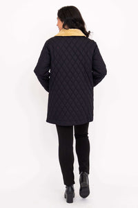 Back view of black quilted coat with tan corduroy collar