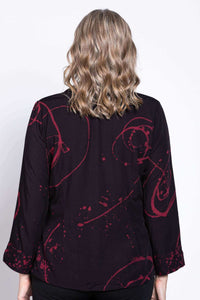 Back view of black blouse with red swirling print, showing shirt collar and sleeves