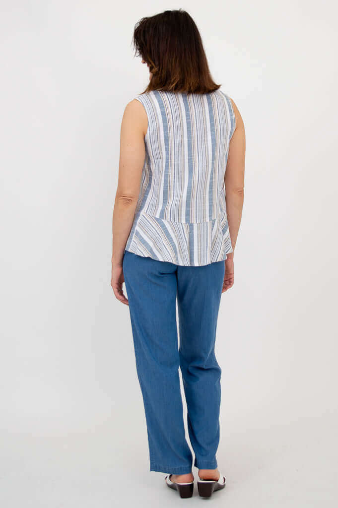 Back view of a woman in a blue and white striped peplum tank top