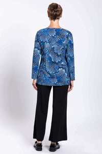 Rear profile shot of a long sleeve blue pattern top displaying clean back drape and length.