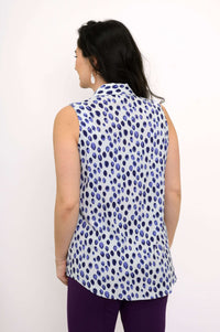 Back view of blue dot print sleeveless tank top worn by woman
