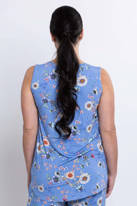 Back view of woman wearing a blue floral sleeveless tank top