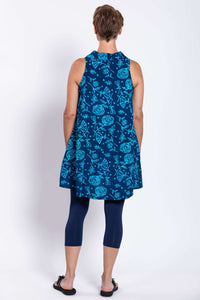 Back view of woman wearing blue floral sleeveless button-up tank dress