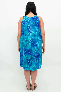 Back view of woman wearing the blue leaf print sleeveless pleated dress