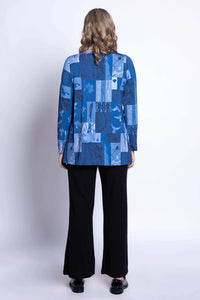 Back view of blue patchwork tunic on model with wavy blonde hair