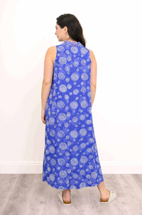 Back view of model wearing a blue sleeveless dress with all-over white swirl patterns