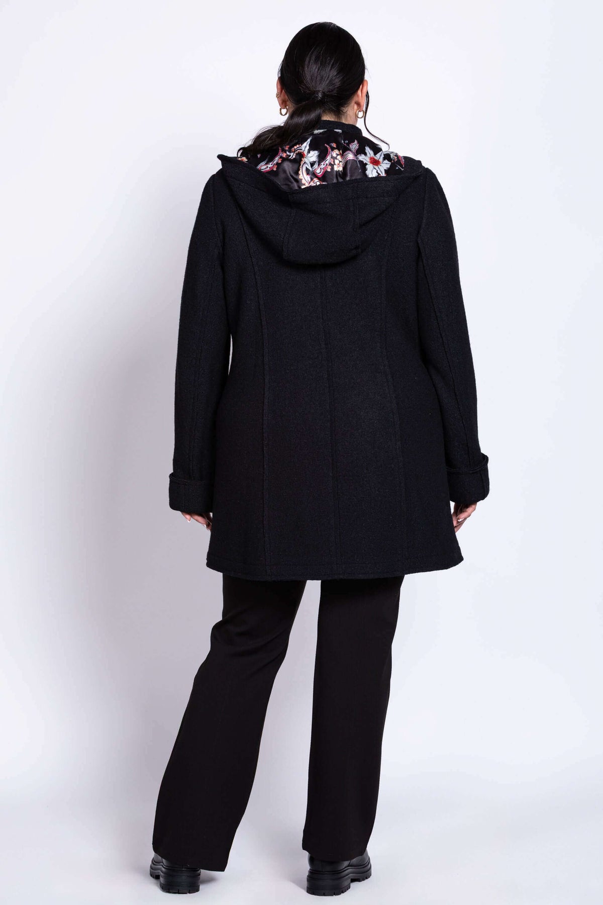 Back view showing hood and floral satin lining of boiled wool car coat