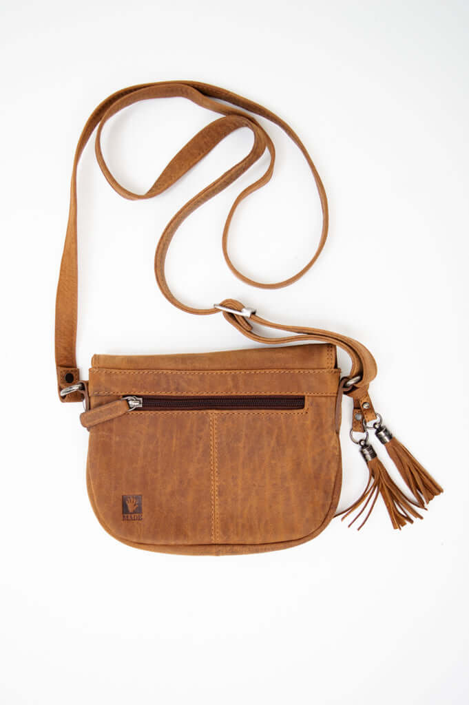 Back view of brown leather crossbody bag with zip pocket and tassels