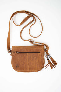 Back view of brown leather crossbody bag with zip pocket and tassels