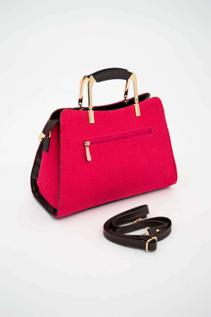 Back view of crimson satchel bag showing rear zipper pocket and detachable strap