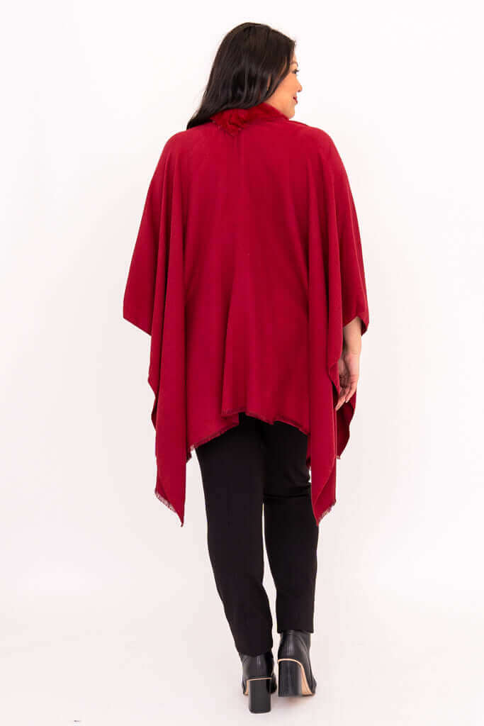 Back view of woman wearing scarlet wrap, showing draped design